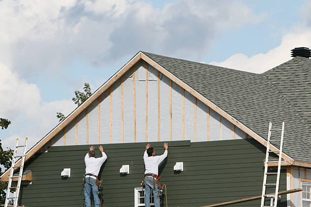 Professional Storm Damage Siding Repair technician working in Paris, TX